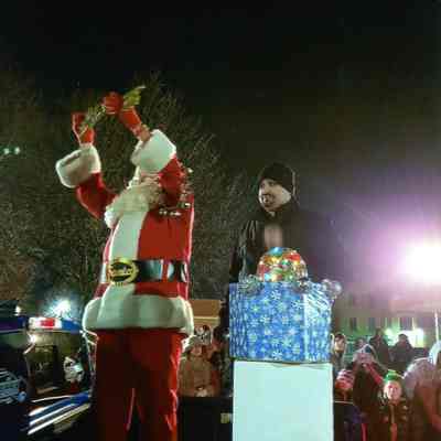 Santa getting the key to the city from Mayor John Rheasa