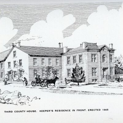 Brick building in rear, keepers house built in front 1865