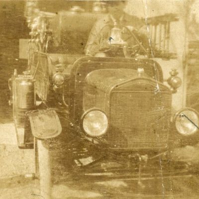 Chief Charles Goudy on 1917 Model T Firetruck
