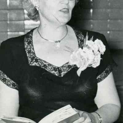 Mrs. Agnes G. doing a book review for the Washington School Girl Scouts in 1953.