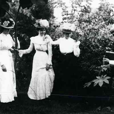 Three women getting their picture taken.