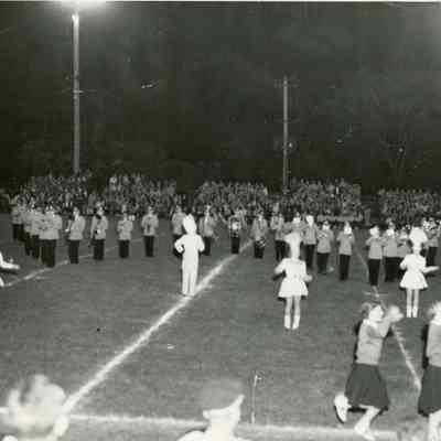 On the field playing a show