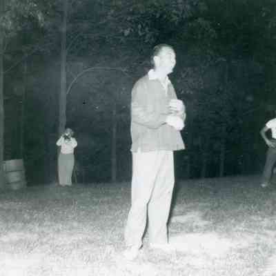Instructor Herkie at bonfire at the Midwest Cheerleads Camp at Smith & Walbridge in Syracuse, Indiana on June 19, 1953.