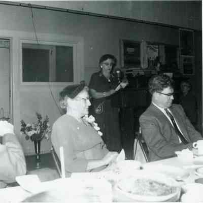 Anna Cady Butler sitting in middle. Lea Shoemaker is speaking. This is her Farewell Party at the Fellowship Hall in Feb. 1954.