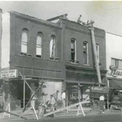 Removing the historic Facades to make a setback from the road. Late 40s or early 1950s. Fisher Cleaners, Wayne Dress Shop, Linda Lee