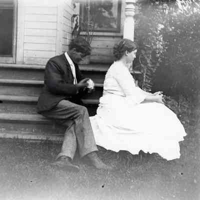 Maude Warner and Clarence Millman on steps of old Warner house, Mich Ave