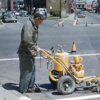 DPW worker painting lines