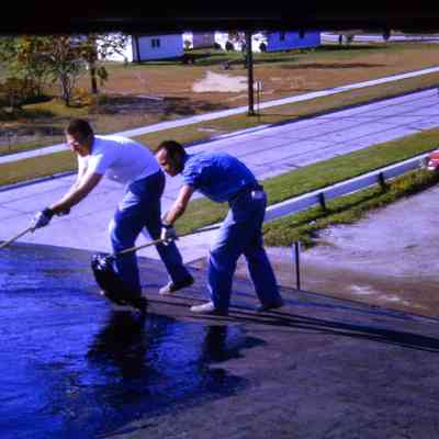 DPW Tarring Roof of DPW Building. October 1963.