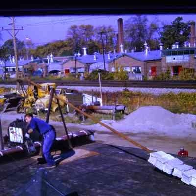 DPW Tarring Roof of DPW Building. October 1963.