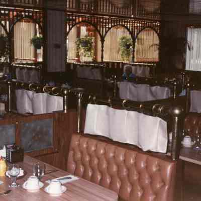Showing frosted glass doors between booths.
