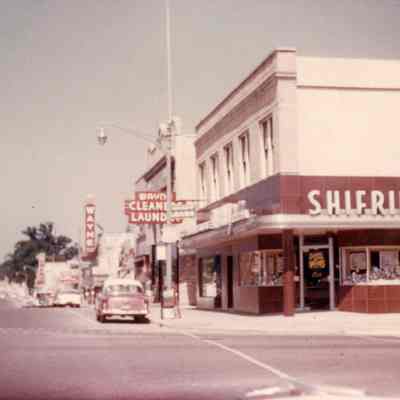 1957. Wayne theater sign, Wayne Cleaners and Laundry, Shifrin