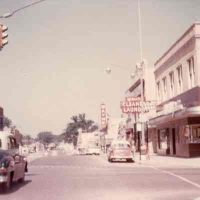 1957. Wayne theater sign, Wayne Cleaners and Laundry, Shifrin