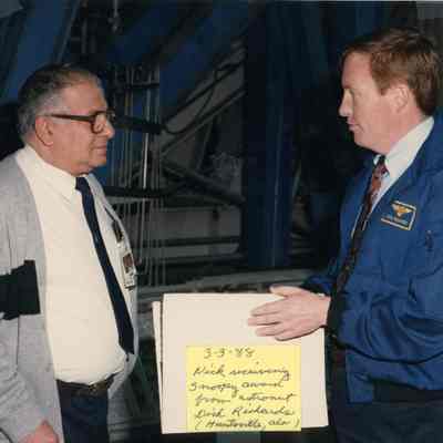 Nick Fama receiving Snoopy Award from astronaut Dick Richards on March 3,1988.
