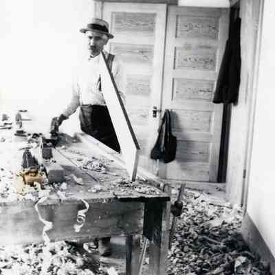 Otis Warner doing carpentry work.