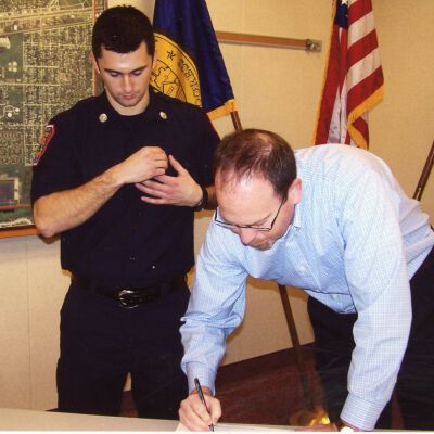 Firefighter being sworn in by City of Wayne Clerk