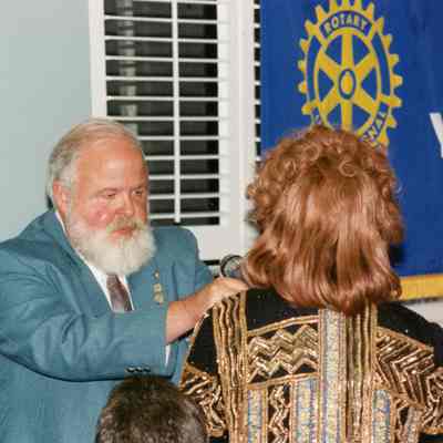 Harlan Whichalo giving Celestine Sanders the Paul Harris Pin.