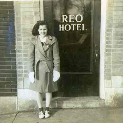 Betty Knight Couvall in front of Door to REO Hotel