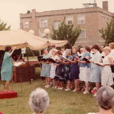 Chancel Choir singing at the Outdoor Service on July 18, 1982.