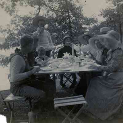 People eating at a campsite.