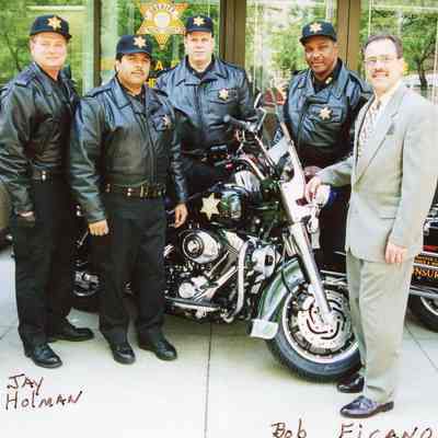 Officers standing next to Patrol Bike