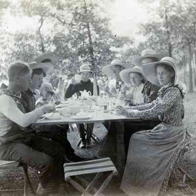People eating at a campsite.