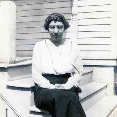 Women sitting on steps of the Martin's house on Norris St.