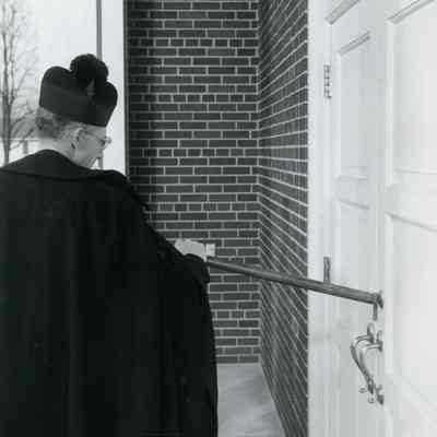 Rev. Elliott knocking on the door