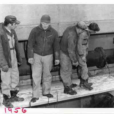 D.P.W workers working on a sewer pipe.
