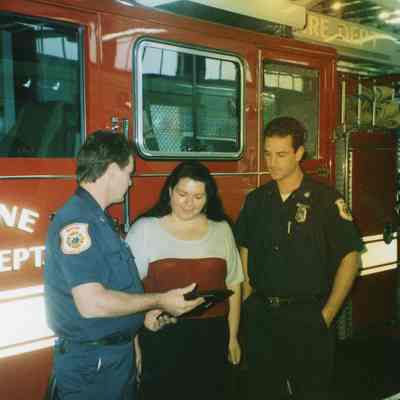 Firefighters with red truck