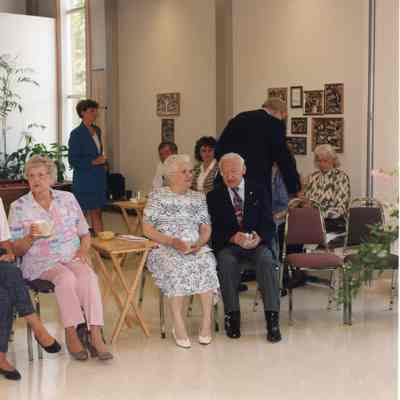 Paul Lada (Dark Suit Sitting) and wife