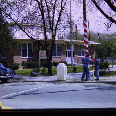 Sign and decorating poles in front of Rec Center, Goudy Park