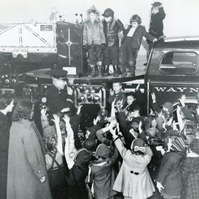 Chief Goudy giving a tour to children