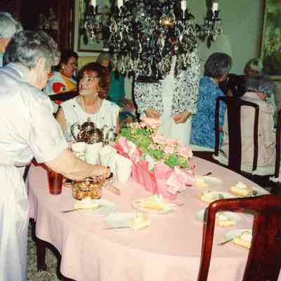 Garden Club Member Mariann Triece sitting at the table.