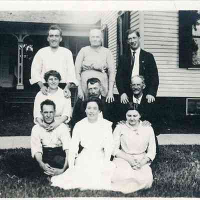 Fass Family in front of Chaffer House, East side of Biddle Street. Formerly Pettingall House, later the Fass's bought it. Nettie is in the middle in the back. (Fass, Tinkham, Thurston, and Hosmer Families)