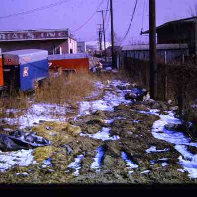 Alleys behind Michigan Ave EB businesses, east of town. South Side.