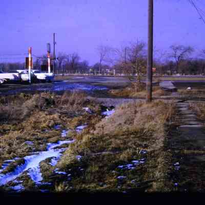 Alleys behind Michigan Ave EB businesses, east of town. South Side. Westlawn Cemetery across Street