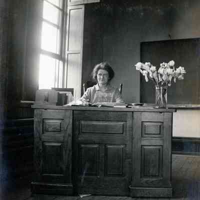 Miss Leta Anisdell at her desk, MSNC on May 26, 1914.