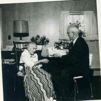 Estelle Bunting on her 100th birthday on March 9,1964 with Rev. Erwin A. Britton at the Clark Convalescent Home.
