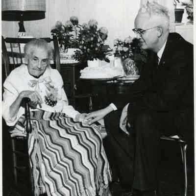 Estelle Bunting on her 100th birthday on March 9,1964 with Rev. Erwin A. Britton at the Clark Convalescent Home.