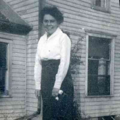 Ellen Martin holding down the pump at the Martin house.