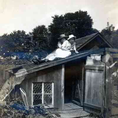 Ellen Martin and Annabell Erwin on top of the Martin's chicken coop on Aug. 21, 1912.