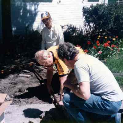 Hank Goudy in orange hat. 1986 new sidewalk