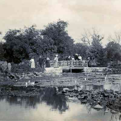 People on a bridge on Belle Isle by Brandt Warner and Mamie Chaffee in the summer of 1900.