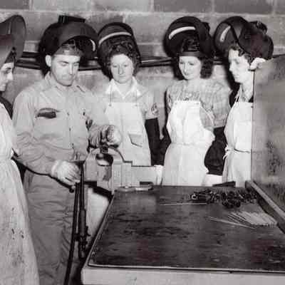 Dan Thomas teaching women to weld
