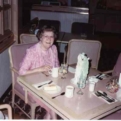 Evelyn with Anniversary Candle at Marriott Courtyard dining room