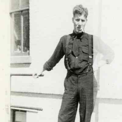 Hank Goudy next to old village Hall