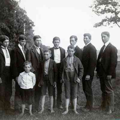 A group photo of boys and men. Brandt Warner on very right.