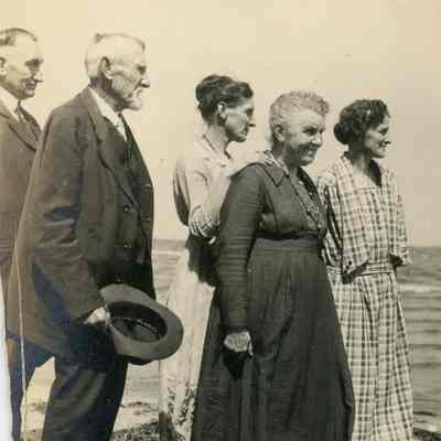 Alice Cady in dark dress in front.