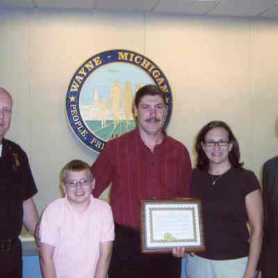 Chief Williams, Patrolman John Buffa and family, Mayor Al