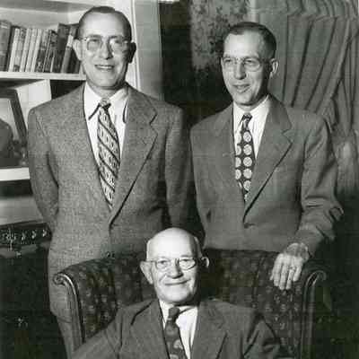 Niram (Nye) Hawley, Thomas Hawley and Rollin N. Hawley sitting.